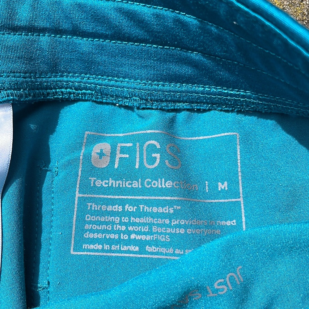 Figs scrubs is the color teal